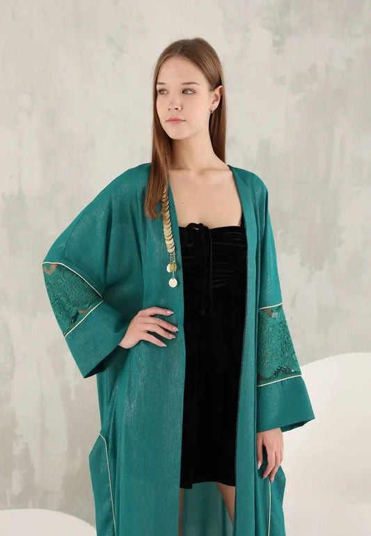 Elegant green shiny women's abaya with golden details