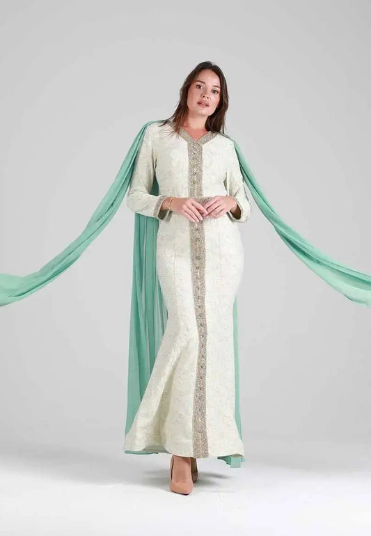 White Moroccan caftan studded with gold with a transparent green abaya